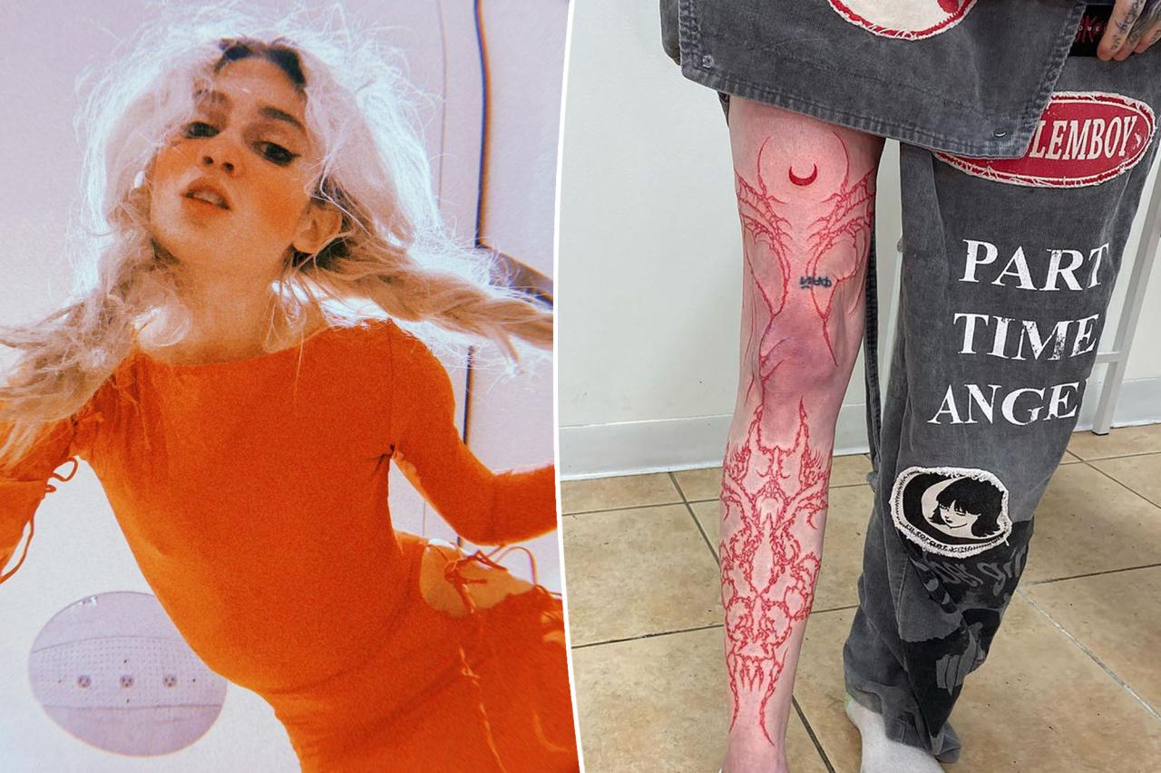 Grimes gets massive red leg tattoo from ankle to thigh