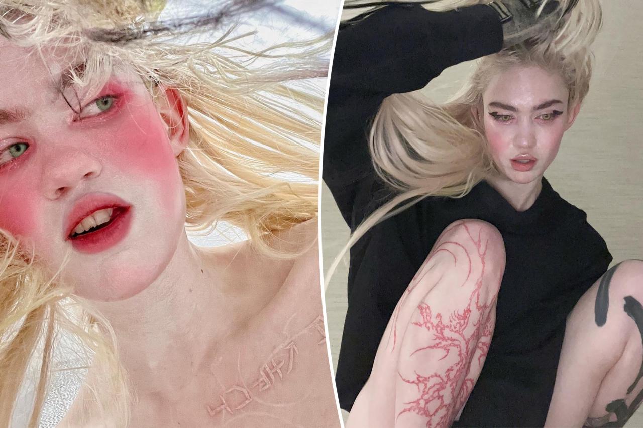 Grimes debuts fresh 'alien scar' chest tattoos, chipped tooth